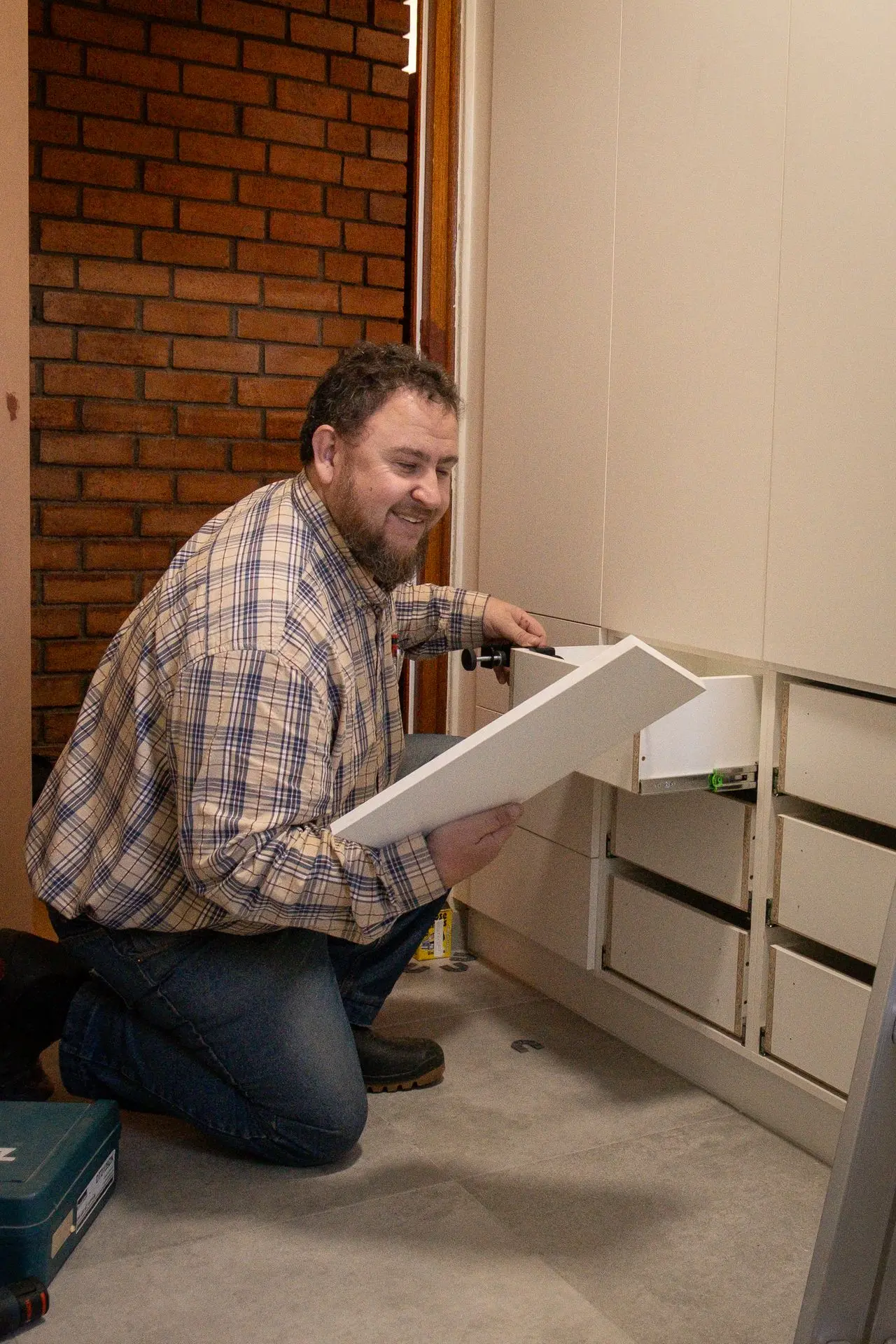 A man holds a melamine chipboard in his hand A man holds a melamine chipboard in his hand